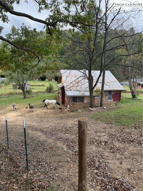 49 Loggy Hollow Road Bakersville, NC 28705 - Photo 10 of 17 a view of a house with a yard