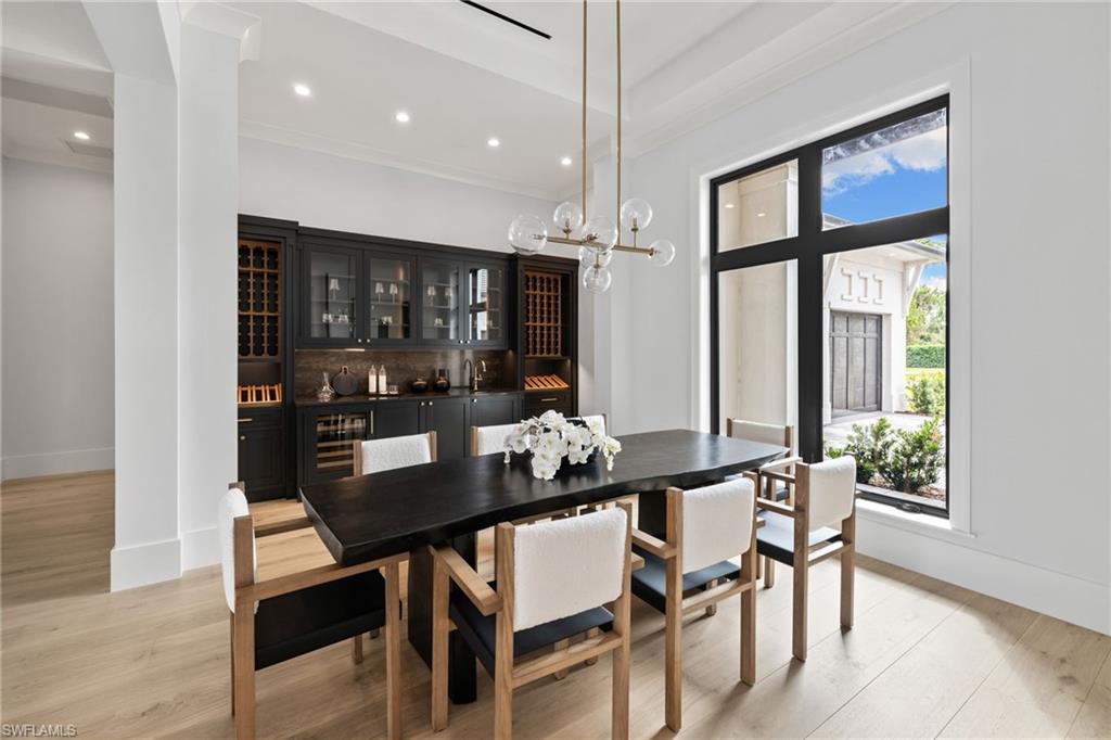 209 Tupelo Road Naples, FL 34108 - Photo 21 of 49 a dining room with furniture and window