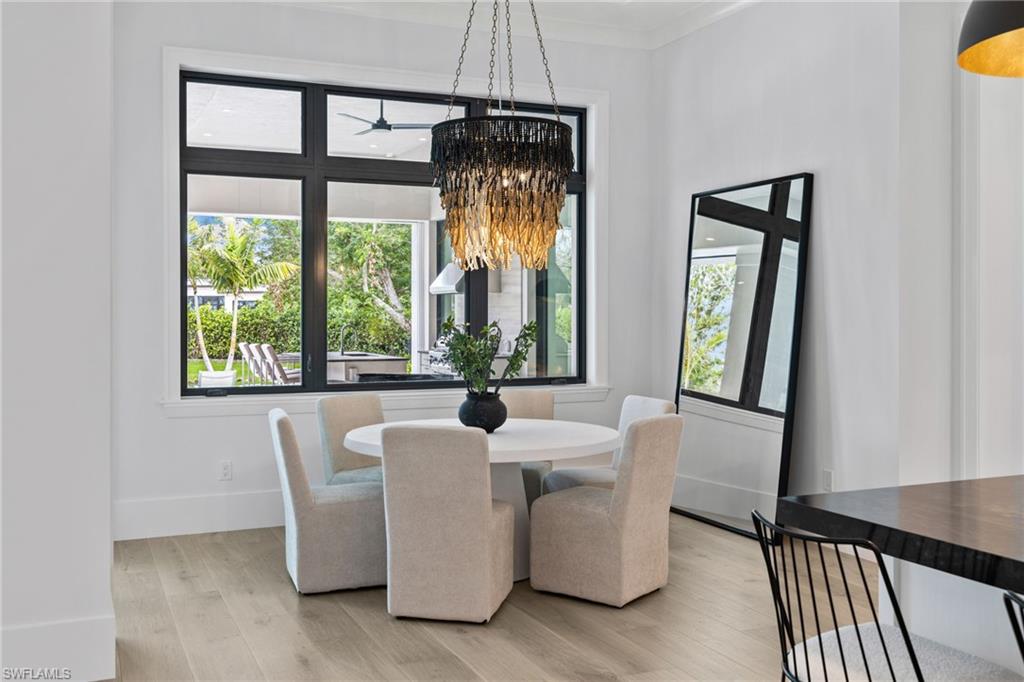 209 Tupelo Road Naples, FL 34108 - Photo 28 of 49 a dining room with furniture and window