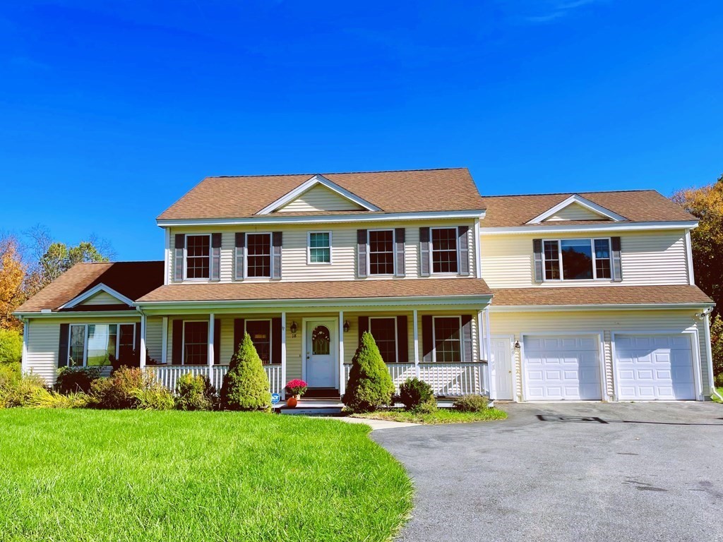 18 Windsor Road Shirley, MA 01464 - Photo 1 of 33 a front view of a house with a yard