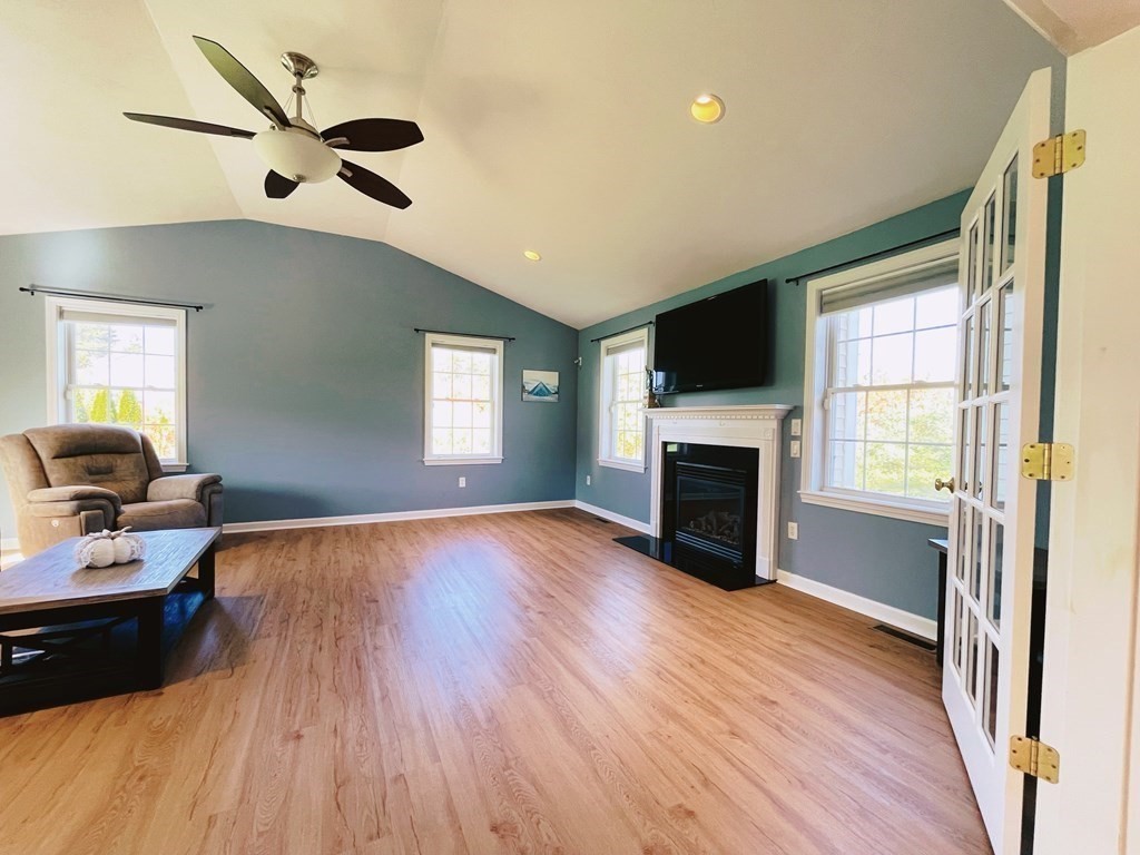 18 Windsor Road Shirley, MA 01464 - Photo 11 of 33 a bed room with furniture and a fireplace
