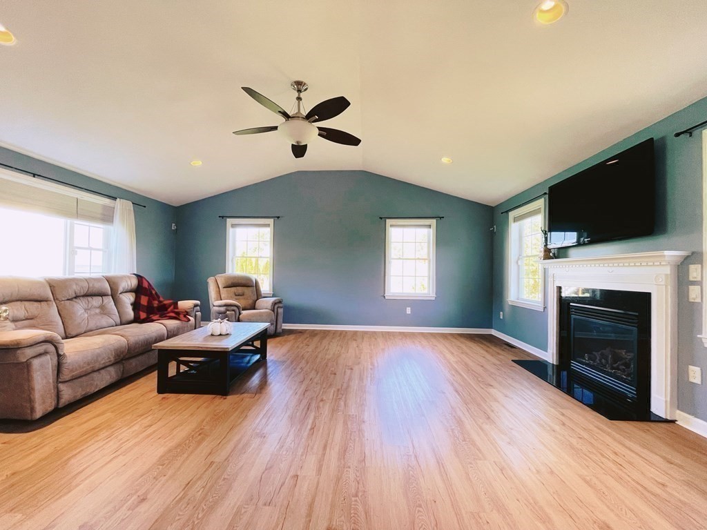 18 Windsor Road Shirley, MA 01464 - Photo 13 of 33 a living room with furniture a fireplace and a flat screen tv
