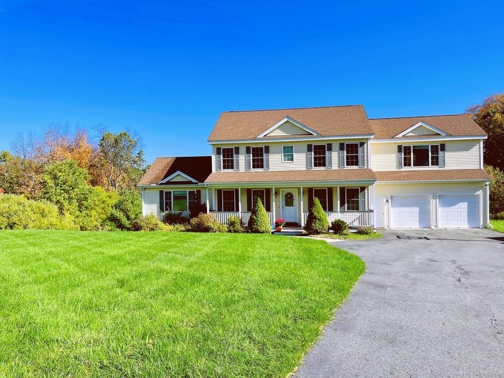 18 Windsor Road Shirley, MA 01464 - Photo 2 of 33 a front view of a house with a garden