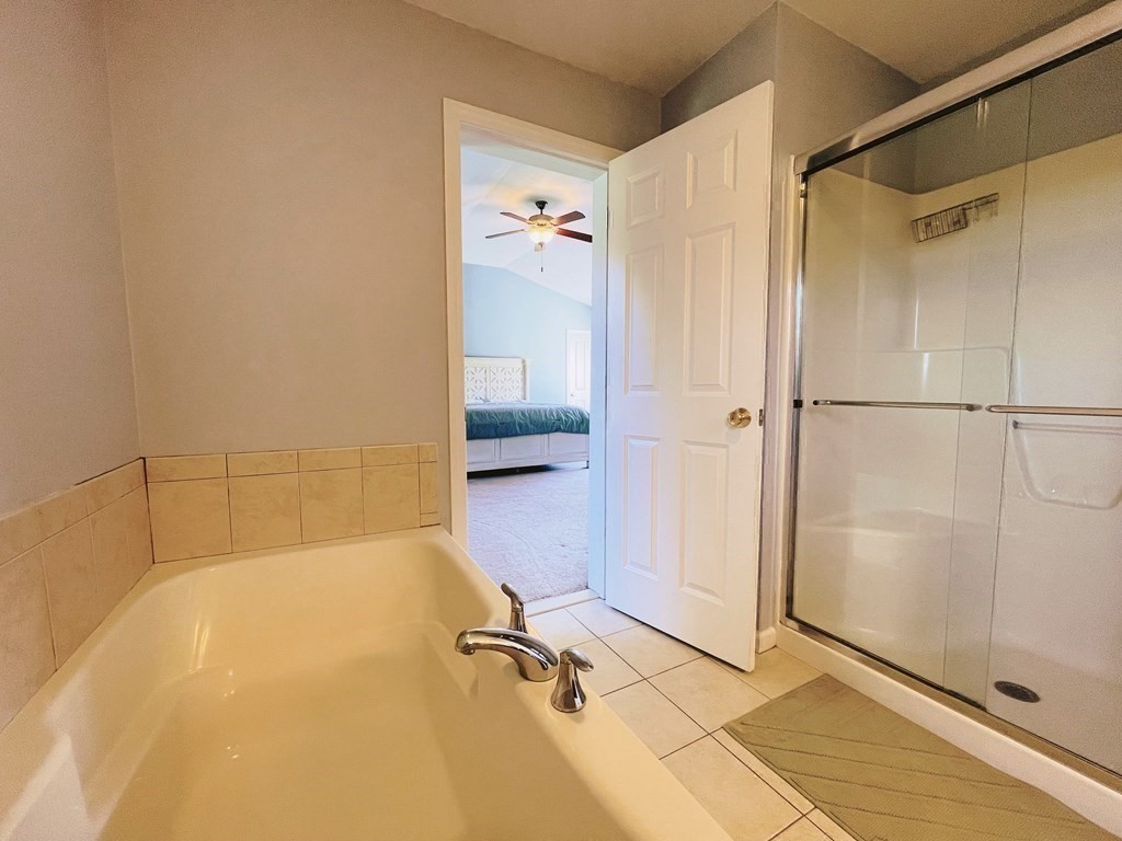 18 Windsor Road Shirley, MA 01464 - Photo 22 of 33 a bathroom with a shower and a glass door