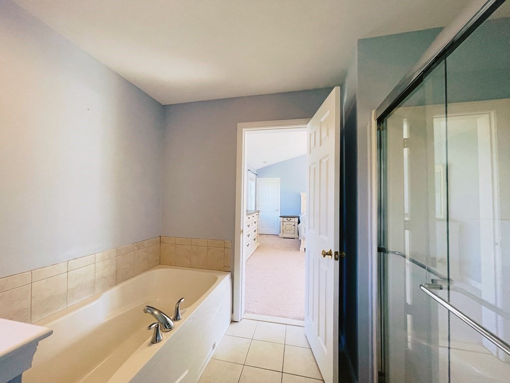 18 Windsor Road Shirley, MA 01464 - Photo 24 of 33 a bathroom with a tub and shower