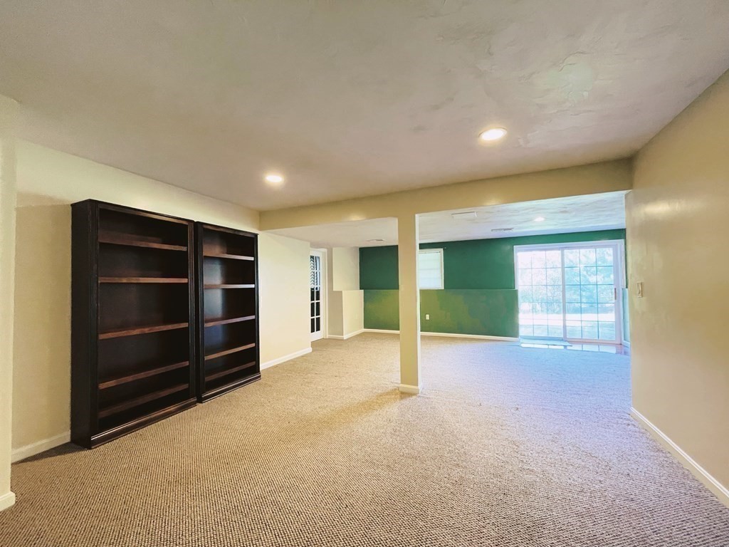 18 Windsor Road Shirley, MA 01464 - Photo 29 of 33 a view of an empty room with a cabinet and a window