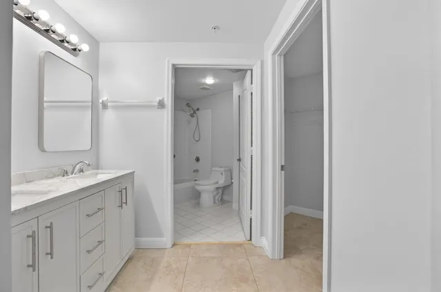 a view of backyard of house with green space