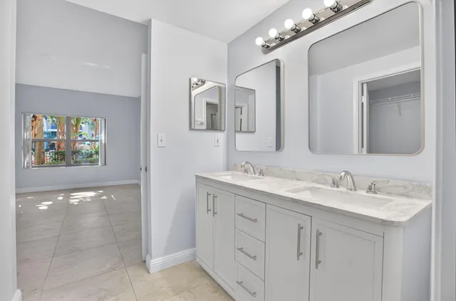 a view of a lake with a house in the background