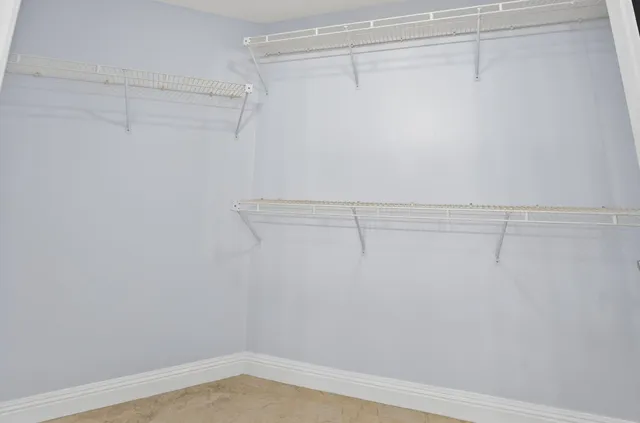 a view of a swimming pool with sitting area