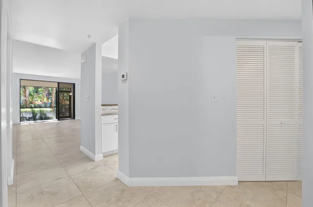a kitchen with stainless steel appliances white cabinets white stainless steel appliances and a refrigerator