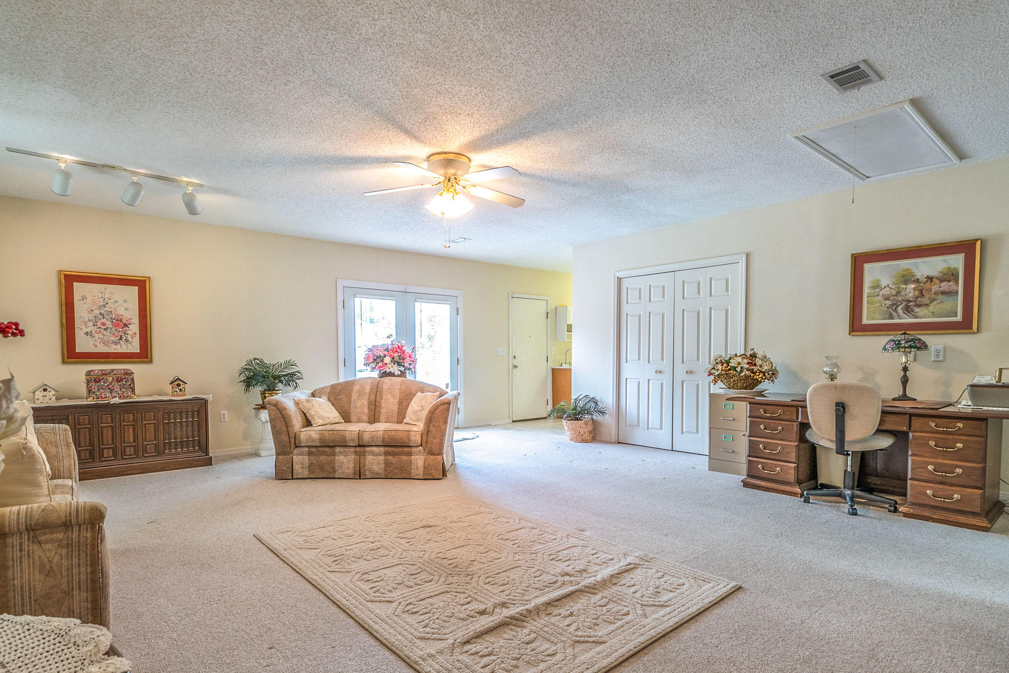 6087 Bud Moulton Road Crestview, FL 32536 - Photo 15 of 30 a living room with furniture and a chandelier