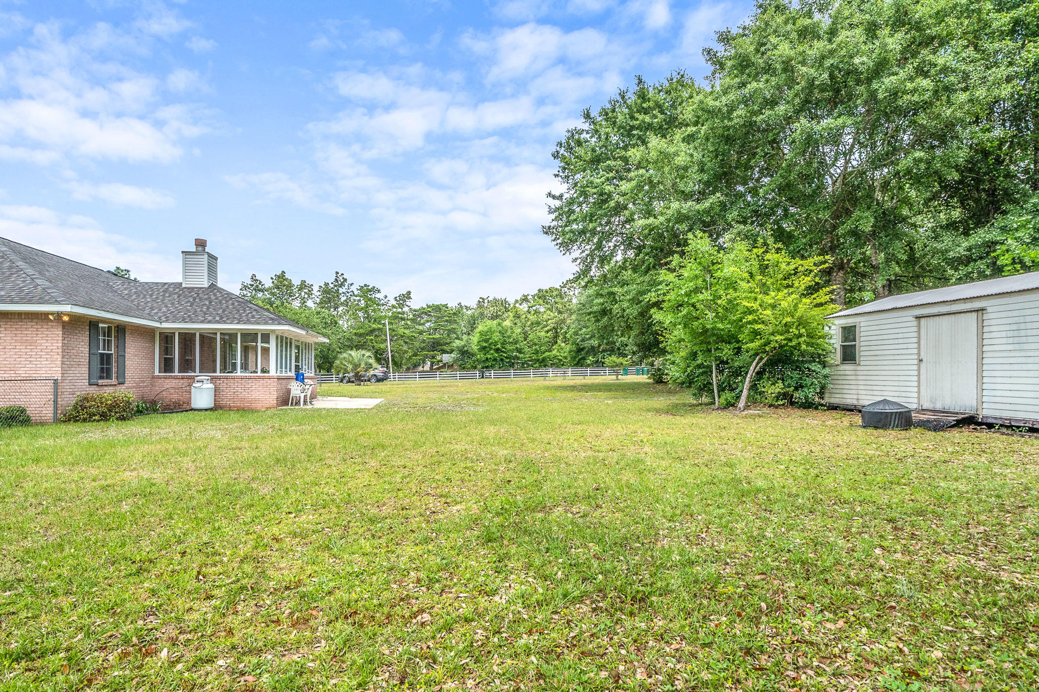 6087 Bud Moulton Road Crestview, FL 32536 - Photo 27 of 30 a front view of a house with a garden