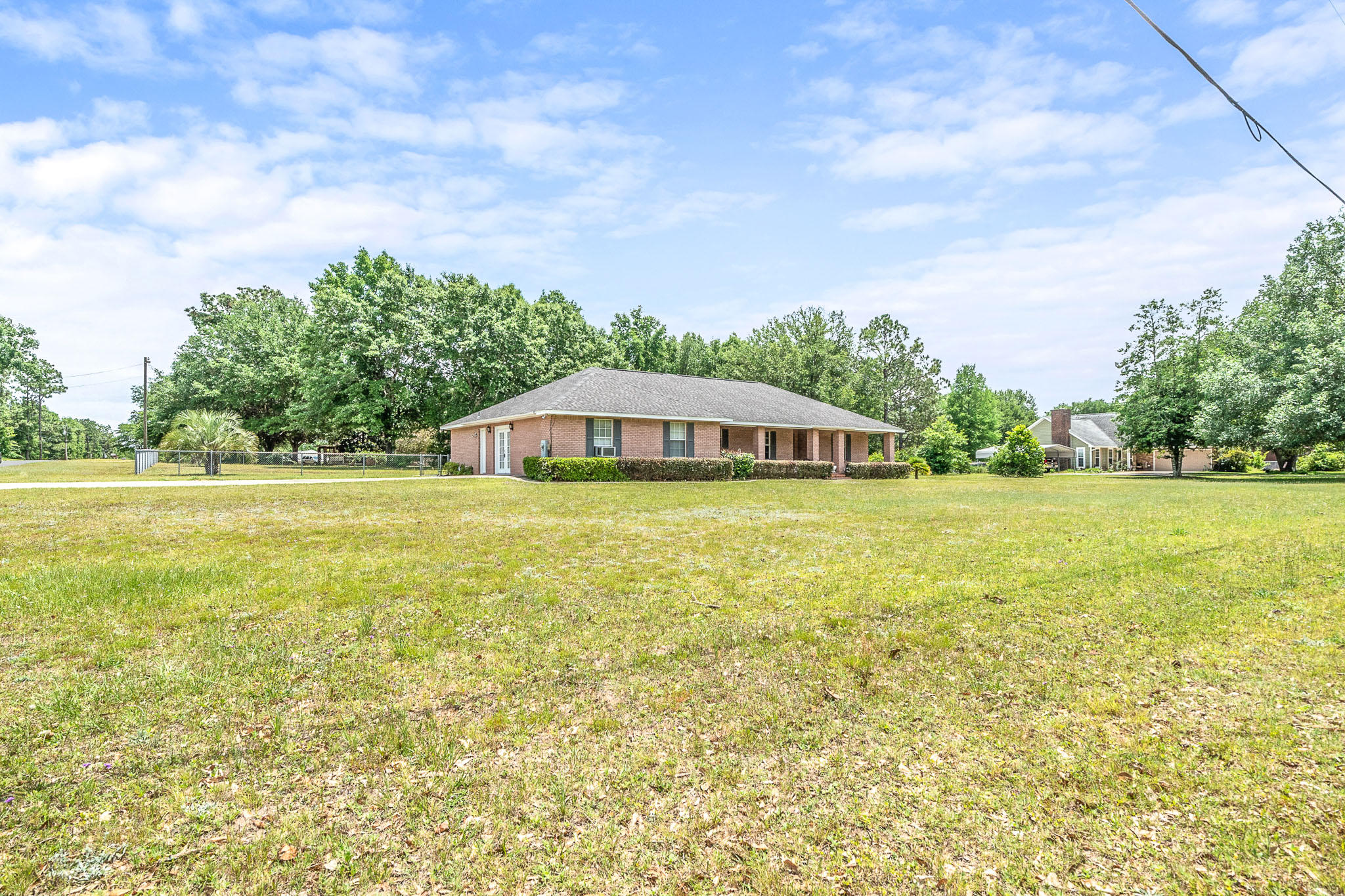 6087 Bud Moulton Road Crestview, FL 32536 - Photo 29 of 30 a view of a house with a yard