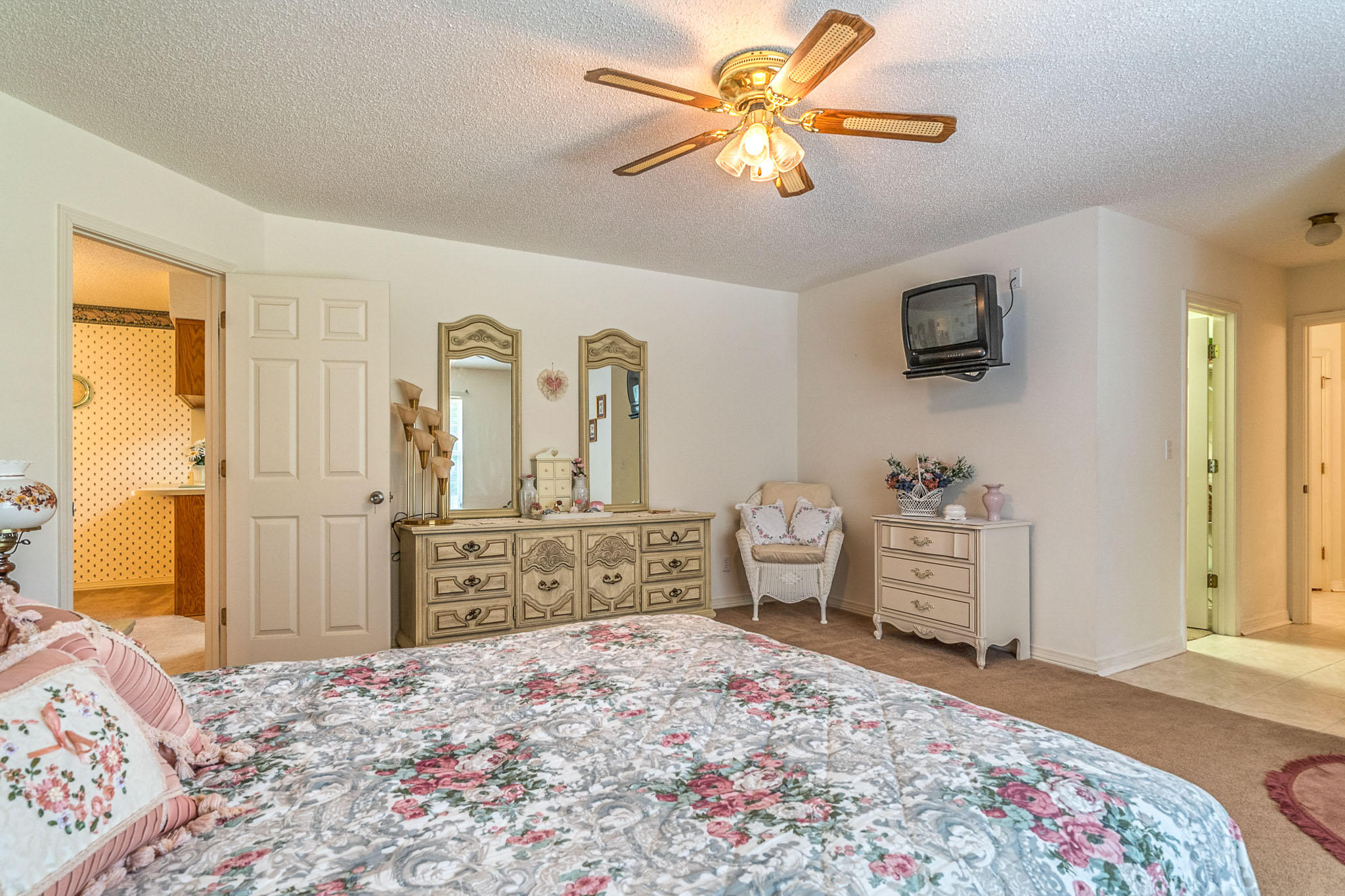 6087 Bud Moulton Road Crestview, FL 32536 - Photo 8 of 30 a bedroom with a bed and a chandelier