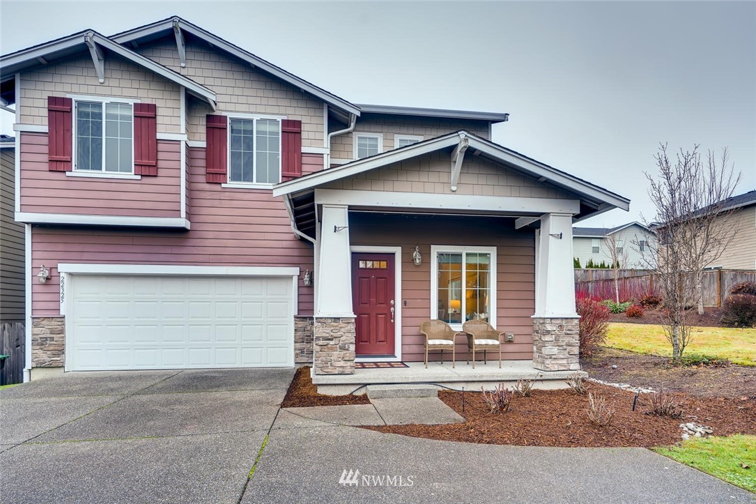 22325 36th Avenue Southeast Bothell, WA 98021 - Photo 1 of 22 a front view of a house with a yard garage and outdoor seating