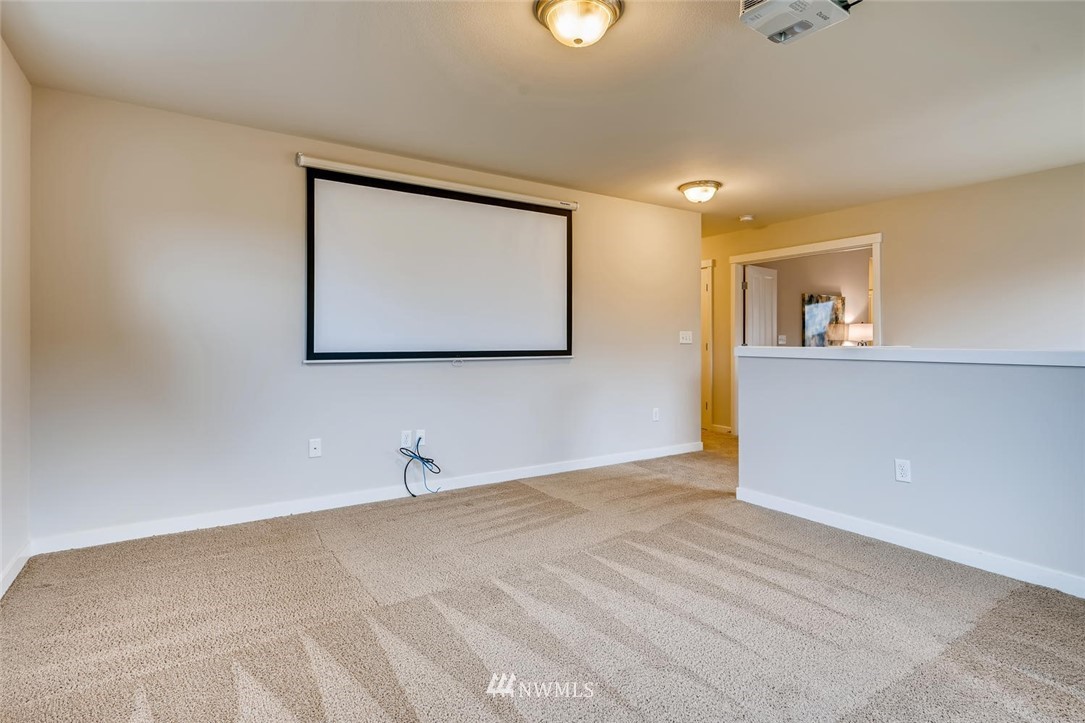 22325 36th Avenue Southeast Bothell, WA 98021 - Photo 17 of 22 a view of a room with wooden floor and cabinet