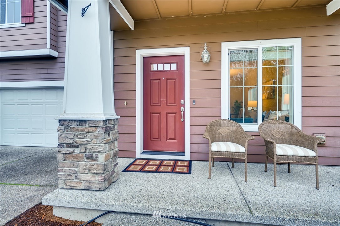 22325 36th Avenue Southeast Bothell, WA 98021 - Photo 3 of 22 a front view of a house with outdoor seating