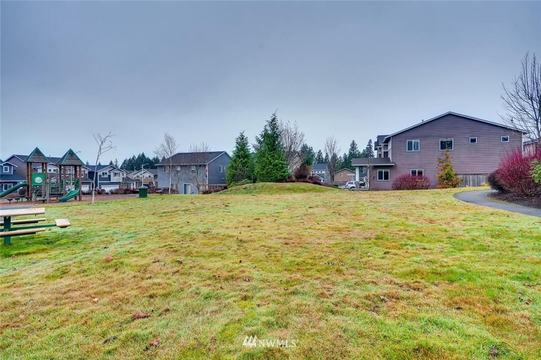22325 36th Avenue Southeast Bothell, WA 98021 - Photo 21 of 22 a view of a house with a yard and a large tree
