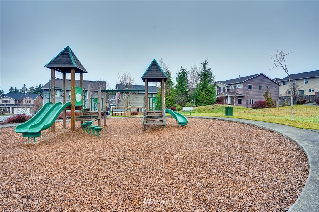 22325 36th Avenue Southeast Bothell, WA 98021 - Photo 22 of 22 a view of a house with a yard and sitting area