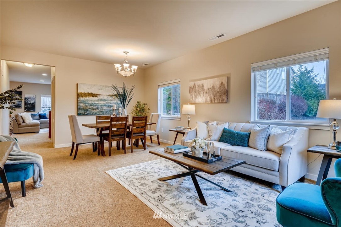 22325 36th Avenue Southeast Bothell, WA 98021 - Photo 4 of 22 a living room with furniture and a dining table