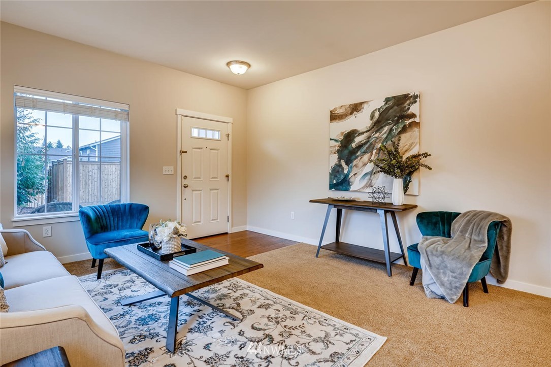 22325 36th Avenue Southeast Bothell, WA 98021 - Photo 5 of 22 a living room with furniture and a window