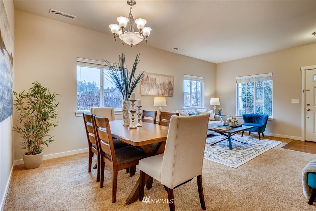 22325 36th Avenue Southeast Bothell, WA 98021 - Photo 6 of 22 a view of a dining room with furniture and chandelier