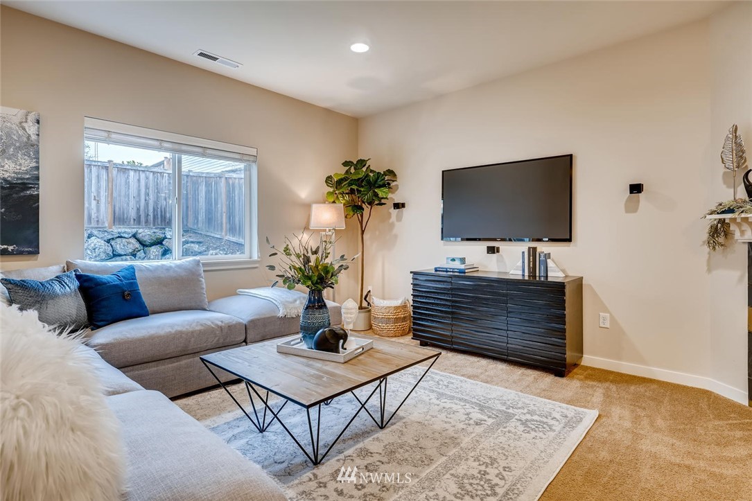 22325 36th Avenue Southeast Bothell, WA 98021 - Photo 9 of 22 a living room with furniture and a flat screen tv