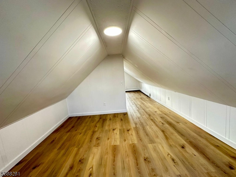 9 Fraser Street, Unit 2 Woodbridge, NJ 08863 - Photo 13 of 16 a view of hallway with stairs