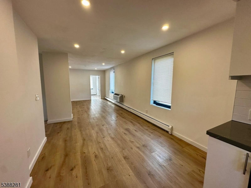 9 Fraser Street, Unit 2 Woodbridge, NJ 08863 - Photo 4 of 16 a view of livingroom with wooden floor