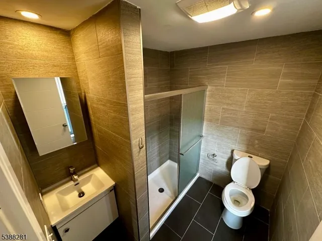 a bathroom with a toilet sink and shower