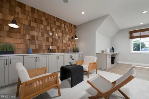 a bedroom with bed and a large window