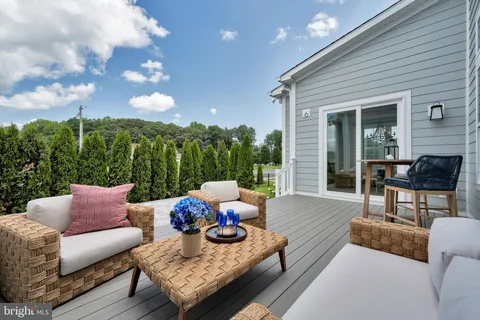 a kitchen with a table chairs stove and cabinets