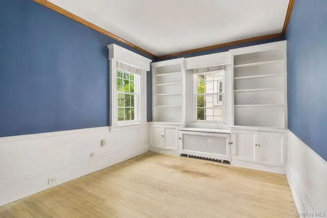 a bathroom with a bathtub and a window