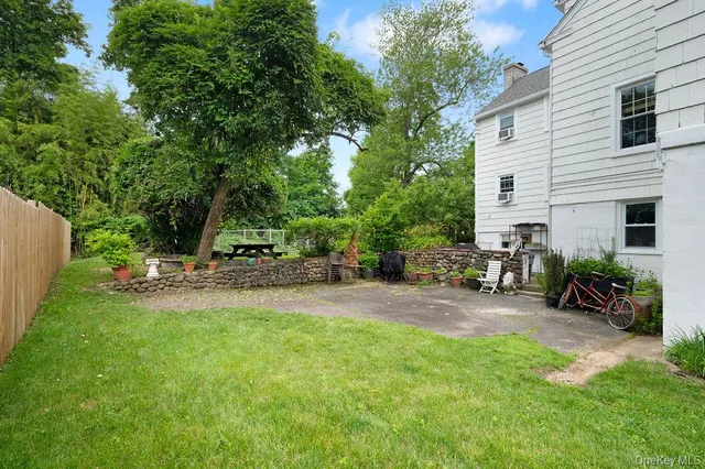 a view of a backyard with sitting area