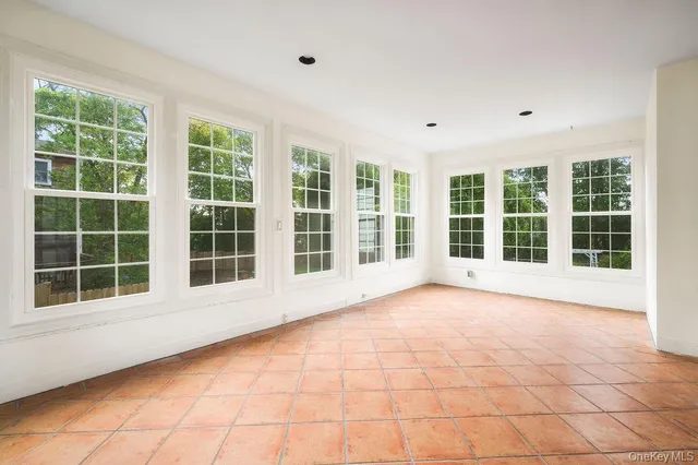 a view of an empty room with a large window