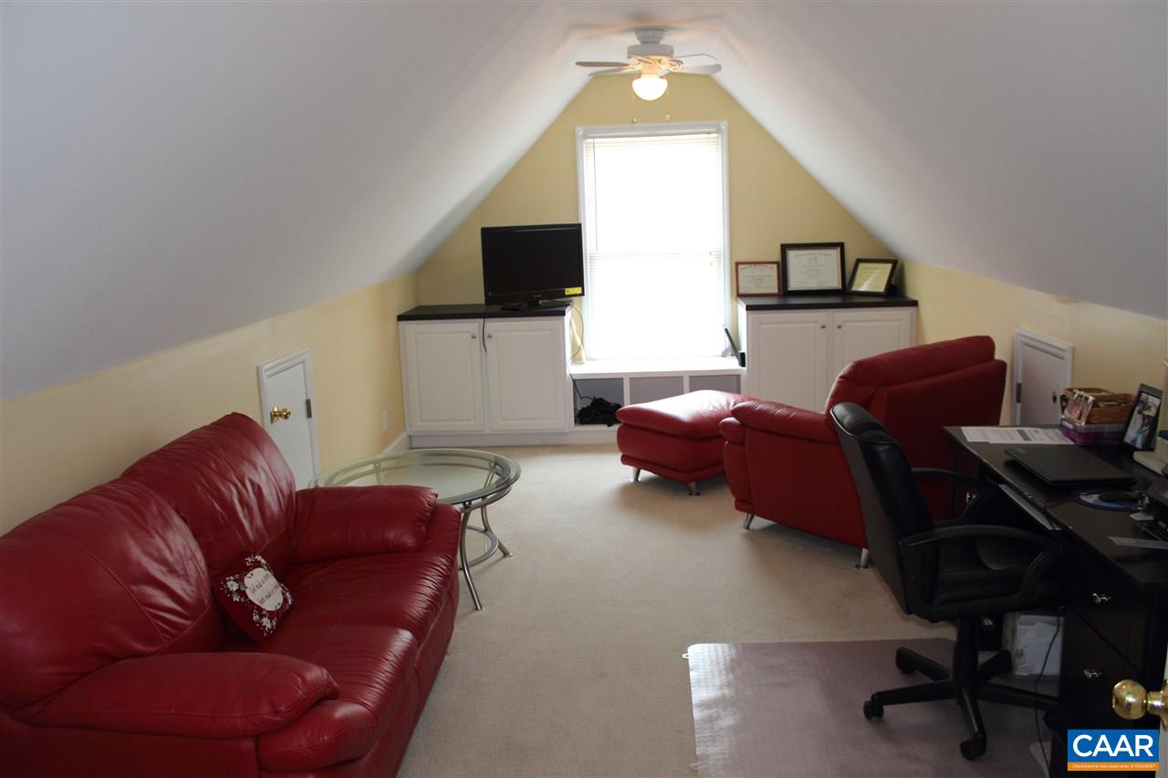 79 Riverside Drive Palmyra, VA 22963 - Photo 11 of 17 a living room with furniture and a flat screen tv
