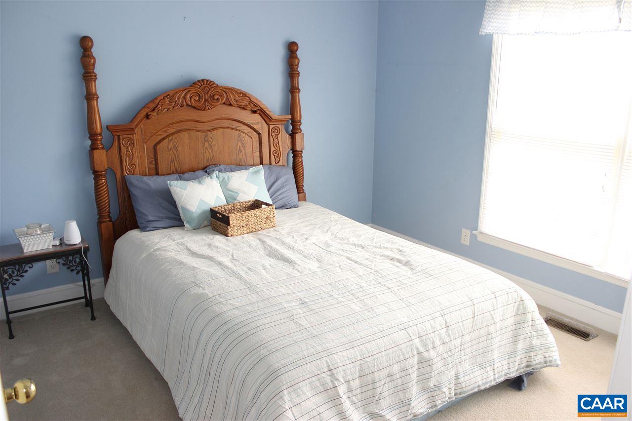79 Riverside Drive Palmyra, VA 22963 - Photo 17 of 17 a bedroom with a bed and wooden floor