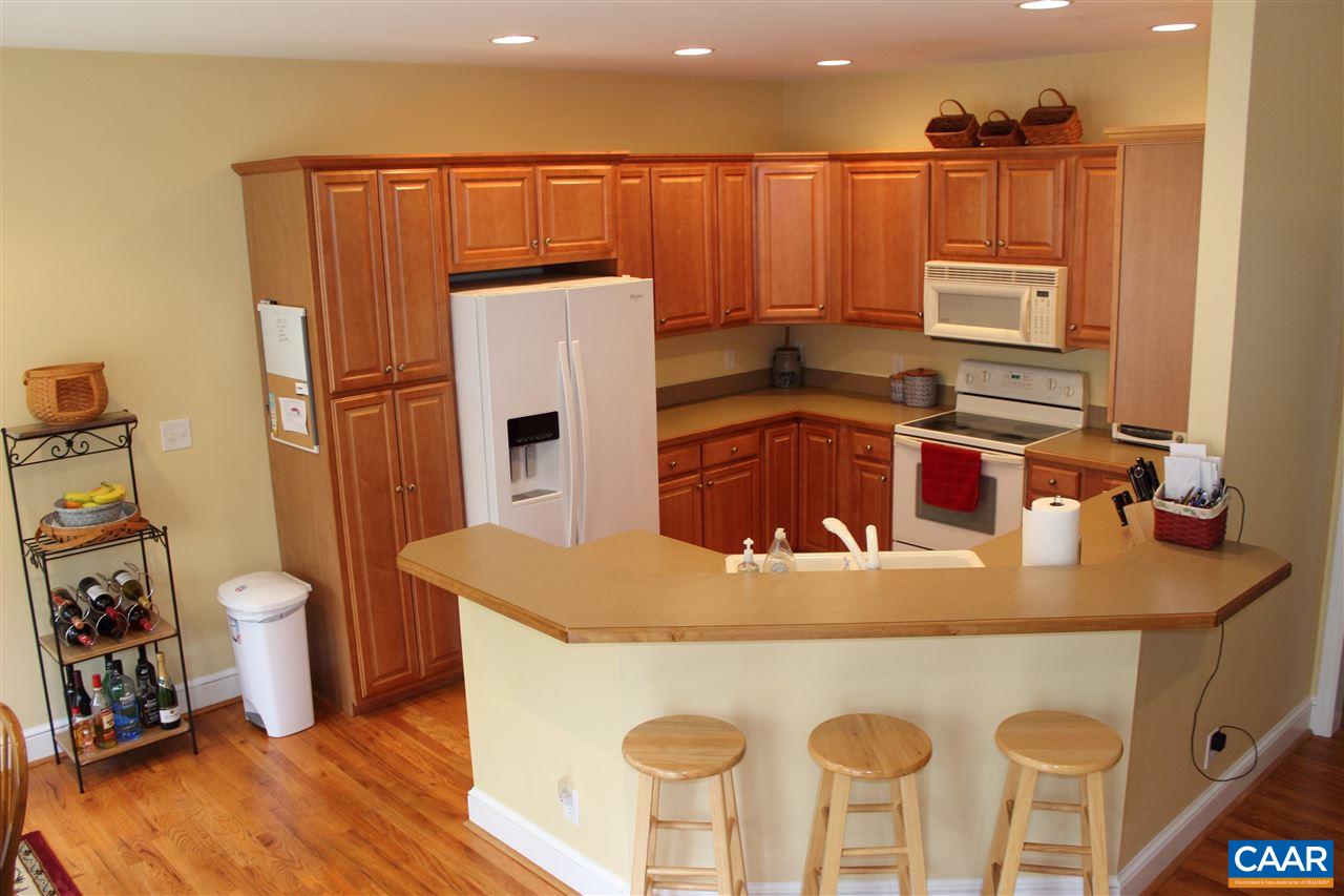 79 Riverside Drive Palmyra, VA 22963 - Photo 7 of 17 a kitchen with stainless steel appliances granite countertop a sink a stove and a refrigerator