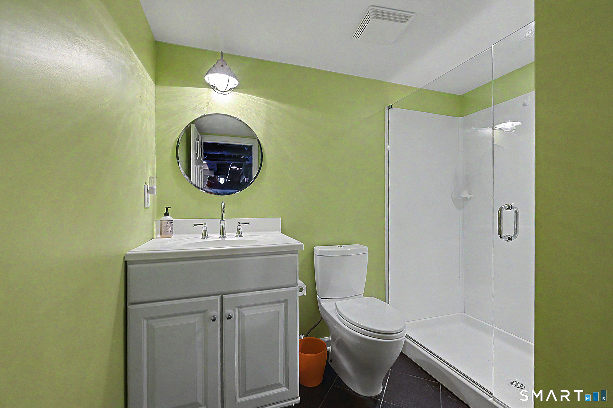33 Hunter Lane Ridgefield, CT 06877 - Photo 33 of 39 a bathroom with a toilet sink and mirror