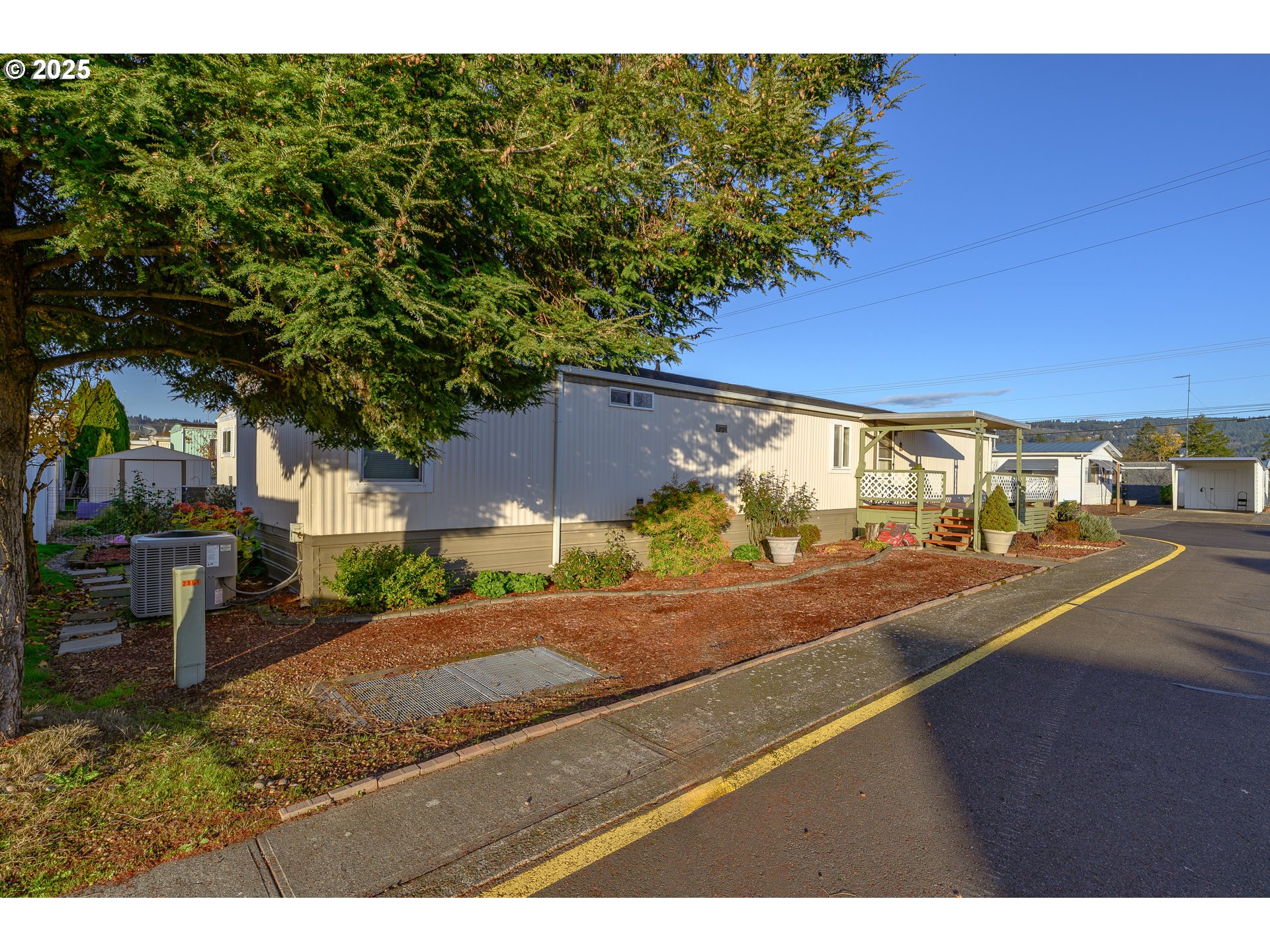 2902 East 2nd Street, Unit 108 Newberg, OR 97132 - Photo 11 of 38 a view of a street with houses
