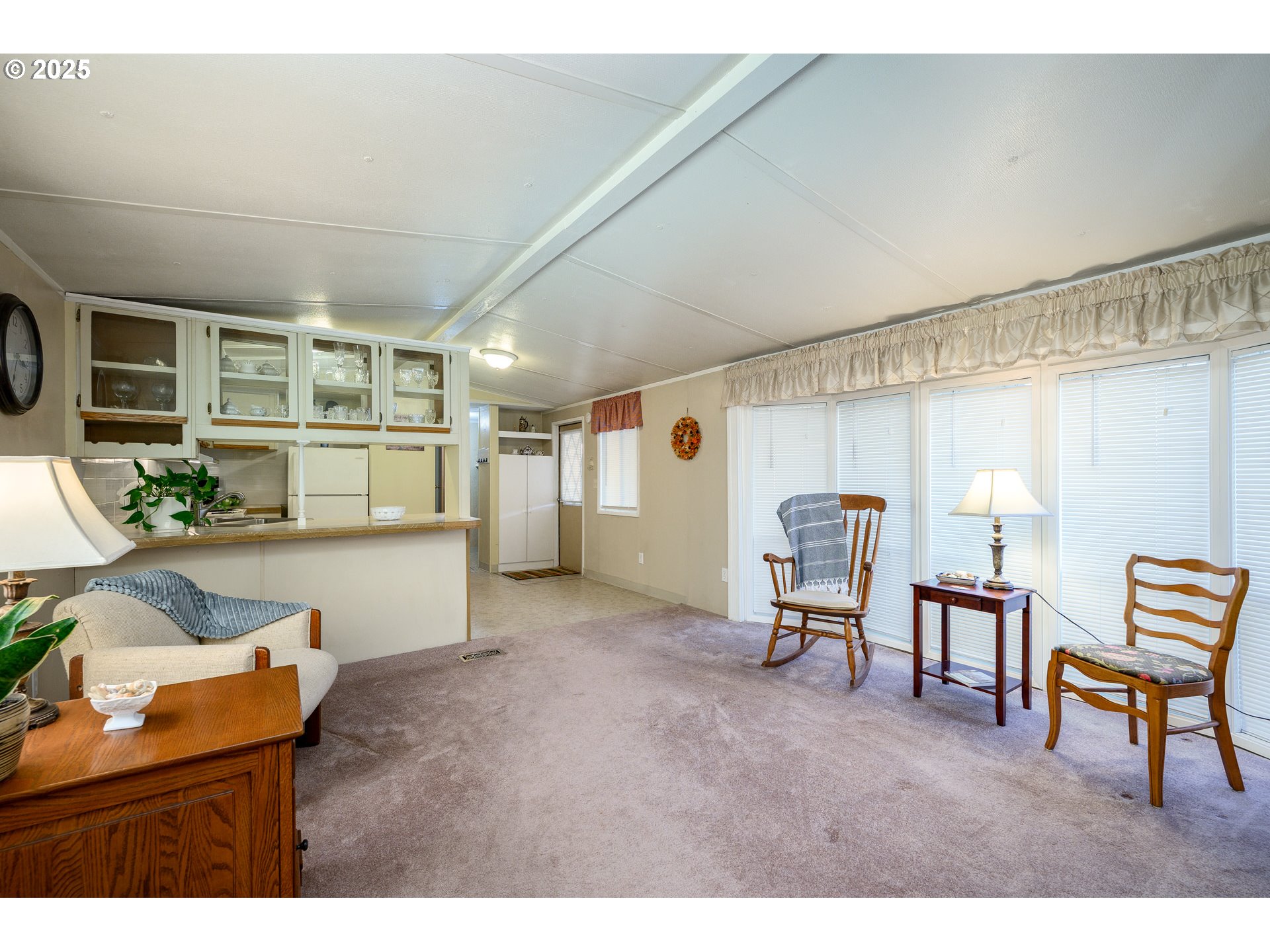 2902 East 2nd Street, Unit 108 Newberg, OR 97132 - Photo 12 of 38 a living room with furniture and a table