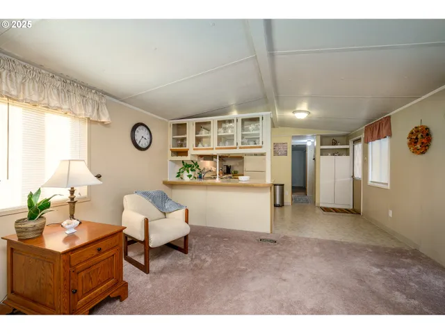 a kitchen with refrigerator and cabinets