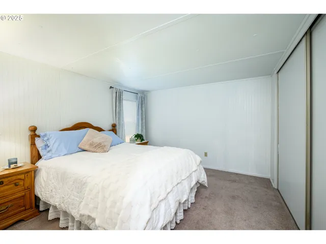 a bedroom with a bed and a cabinets