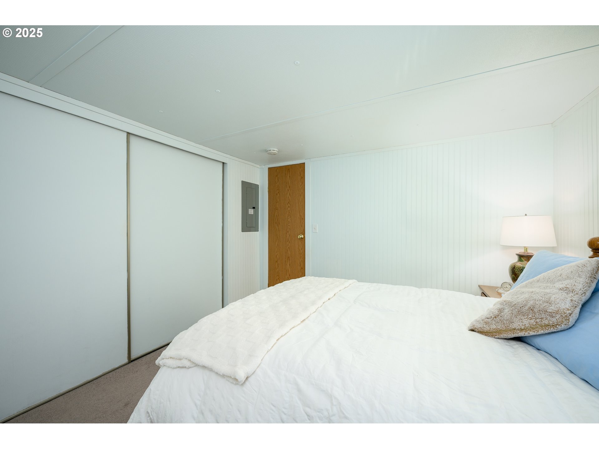 2902 East 2nd Street, Unit 108 Newberg, OR 97132 - Photo 20 of 38 a bedroom with a bed and a cabinets