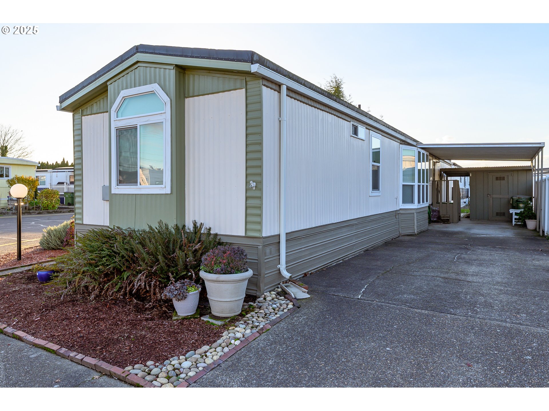 2902 East 2nd Street, Unit 108 Newberg, OR 97132 - Photo 2 of 38 a house view with a outdoor space