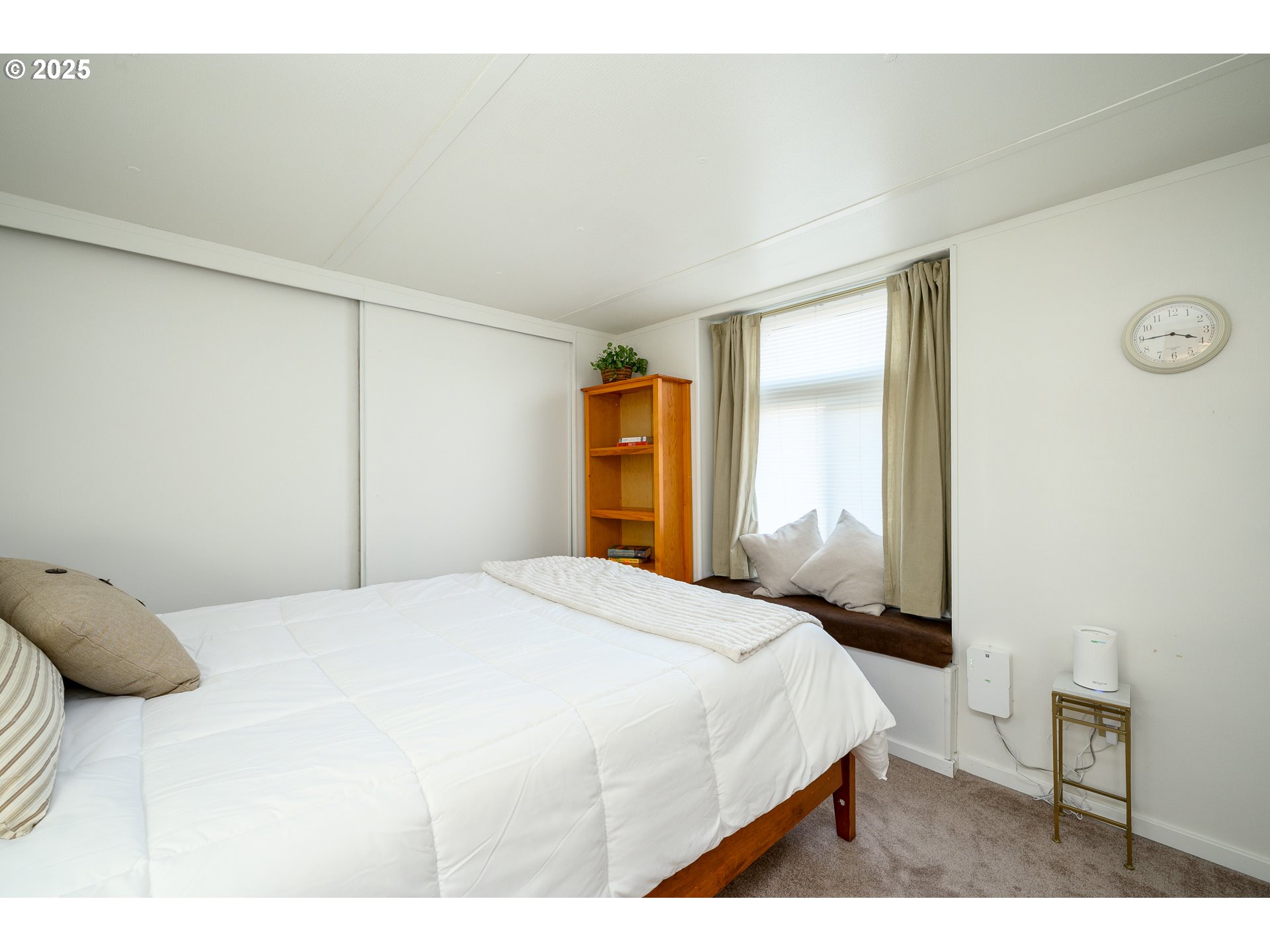 2902 East 2nd Street, Unit 108 Newberg, OR 97132 - Photo 25 of 38 a bedroom with a bed and a cabinets