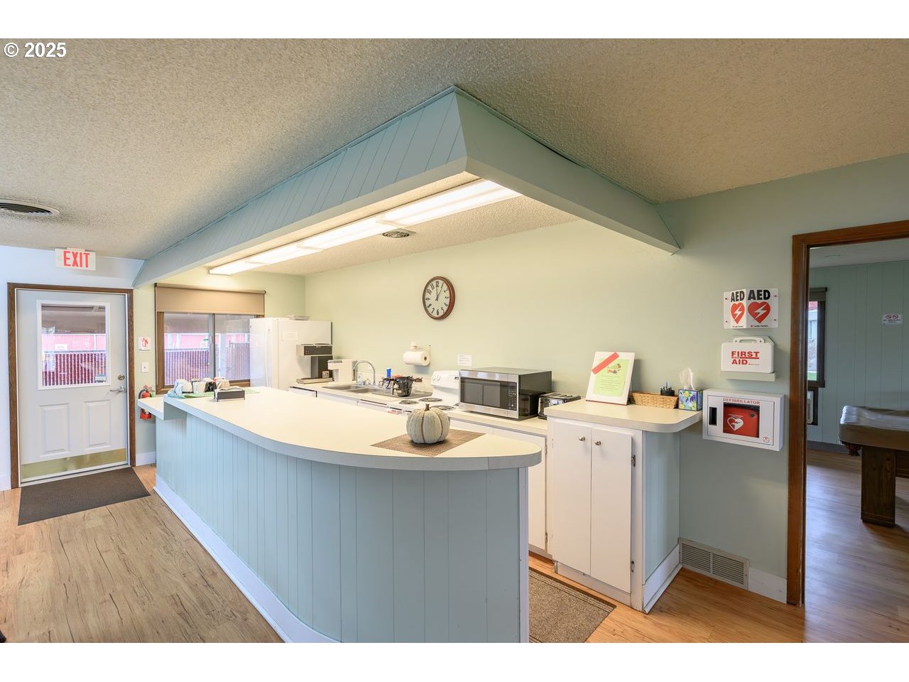 2902 East 2nd Street, Unit 108 Newberg, OR 97132 - Photo 37 of 38 a kitchen with a sink and wooden floor