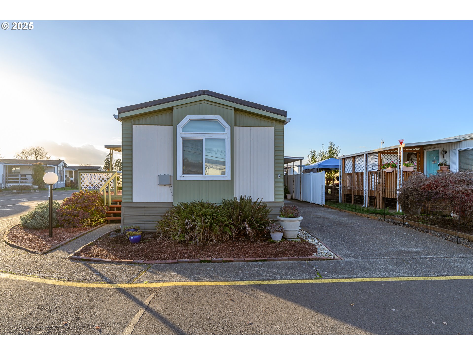 2902 East 2nd Street, Unit 108 Newberg, OR 97132 - Photo 4 of 38 a front view of a house with a yard