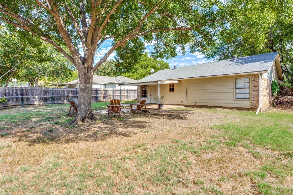 825 Blue Ridge Drive Burleson, TX 76028 - Photo 24 of 25 Another view of the back yard, plenty of space and shade in which to relax after a long day.