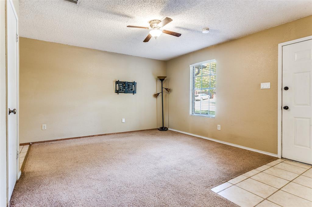 825 Blue Ridge Drive Burleson, TX 76028 - Photo 5 of 25 Another view of main living area located just off the kitchen. Light colored carpeting throughout most of the home. Seller is offering a $2500 flooring allowance with an acceptable offer.